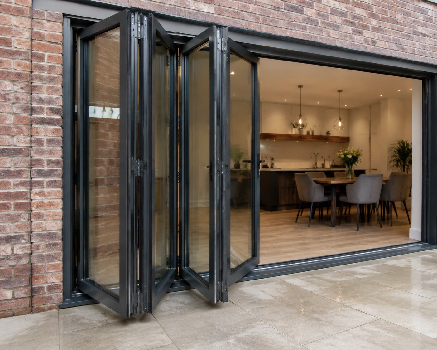 Close view of hinged aluminium bifold panels stacking open